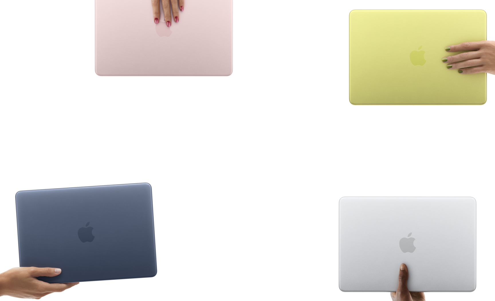 MacBook Neo laptops in various colours, each held in a different person's hand