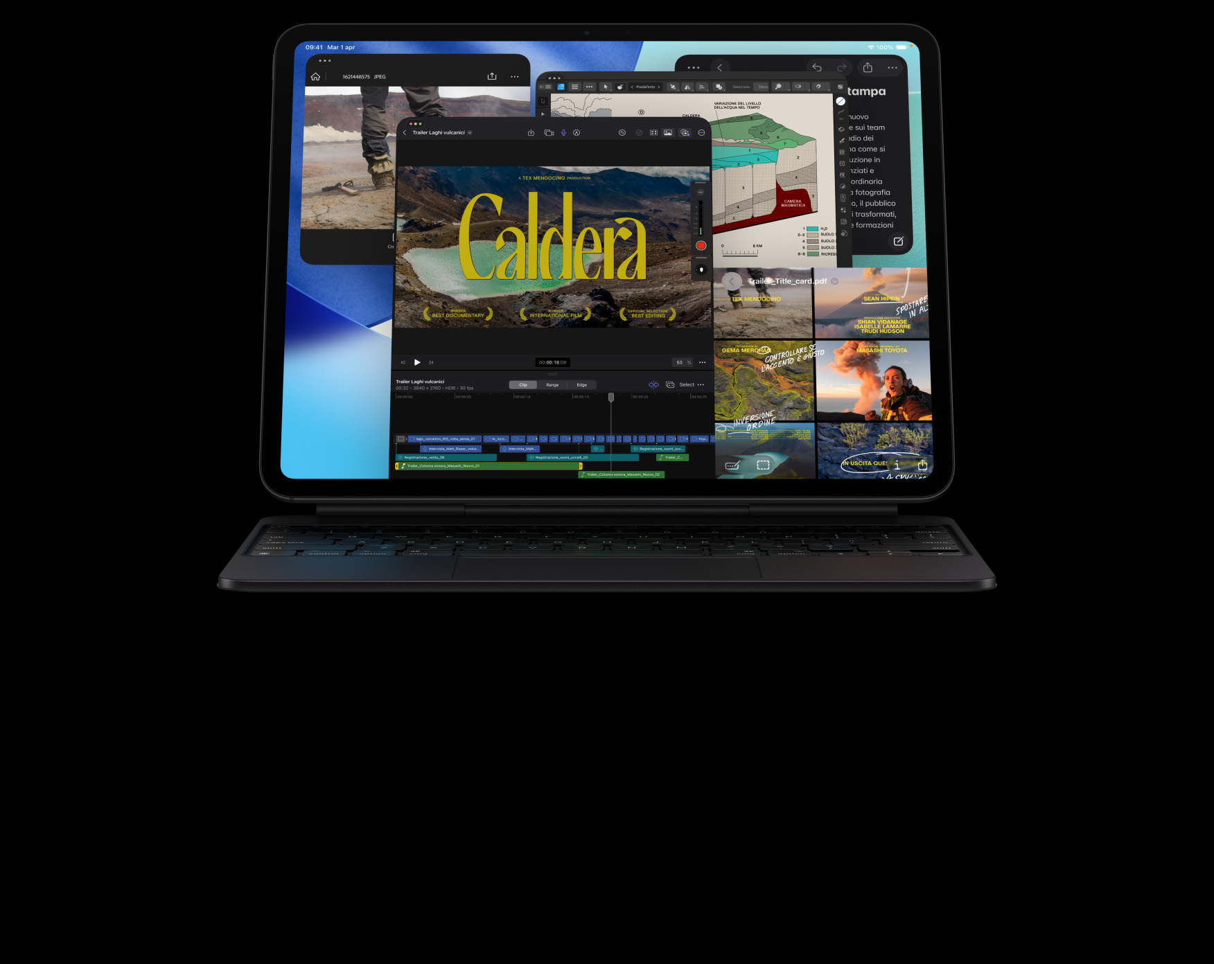 Un iPad Pro nero siderale in orizzontale visto di fronte con una Magic Keyboard nero siderale agganciata; il display mostra più finestre di app sovrapposte, tra cui Final Cut Pro con diverse funzioni di editing video e la timeline, Mappe, Note e vari clip multimediali